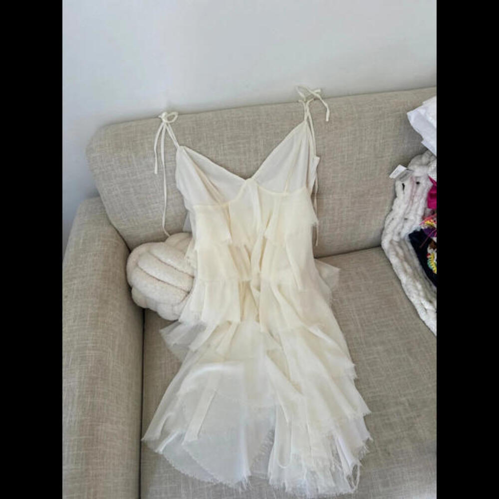 Mistress rocks white layered mini dress